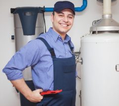 Portrait of a smiling plumber at work